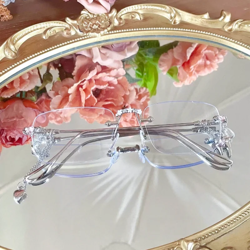 A stylish close-up view featuring Y2K Rimless Glasses in silver metal for everyday alt-fashion styling.